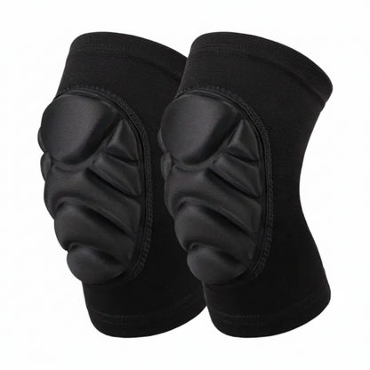 A pair of black protective knee pads with molded foam padding, shown against a plain white background with a 'Sporting goods.lb' watermark in the top right.